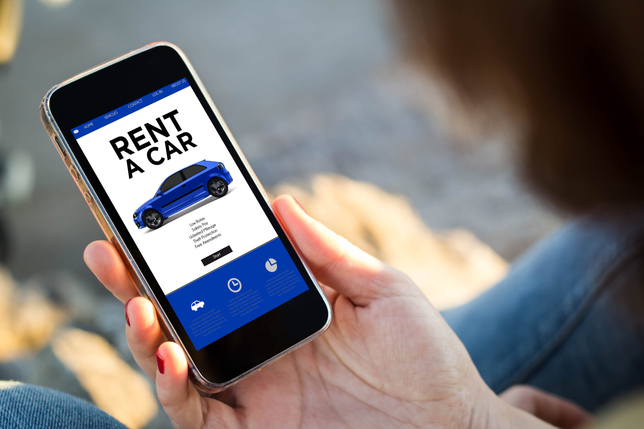 close-up view of young woman renting a car with her mobile phone. All screen graphics are made up.